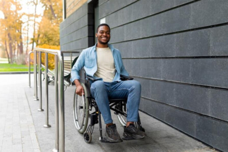 A man in a wheelchair entering a venue