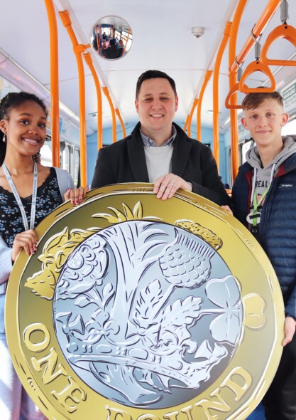 Mayor Houchen with a giant £1 on a bus